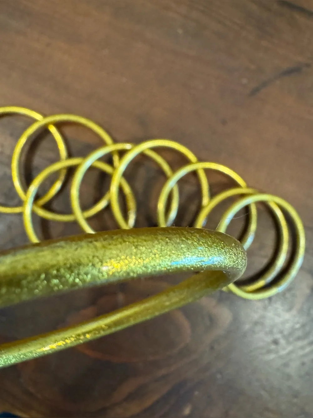 Set of 9 gold plastic glitter bracelets